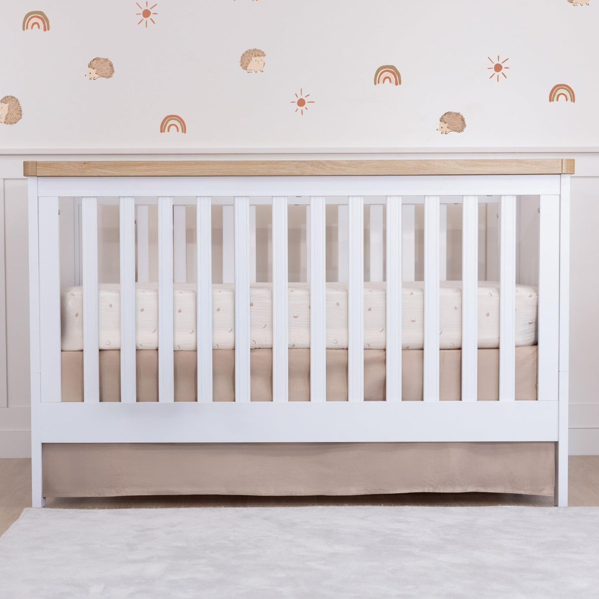 MY LITTLE ZONE brown crib skirt front view for a gender-neutral nursery and tidy space