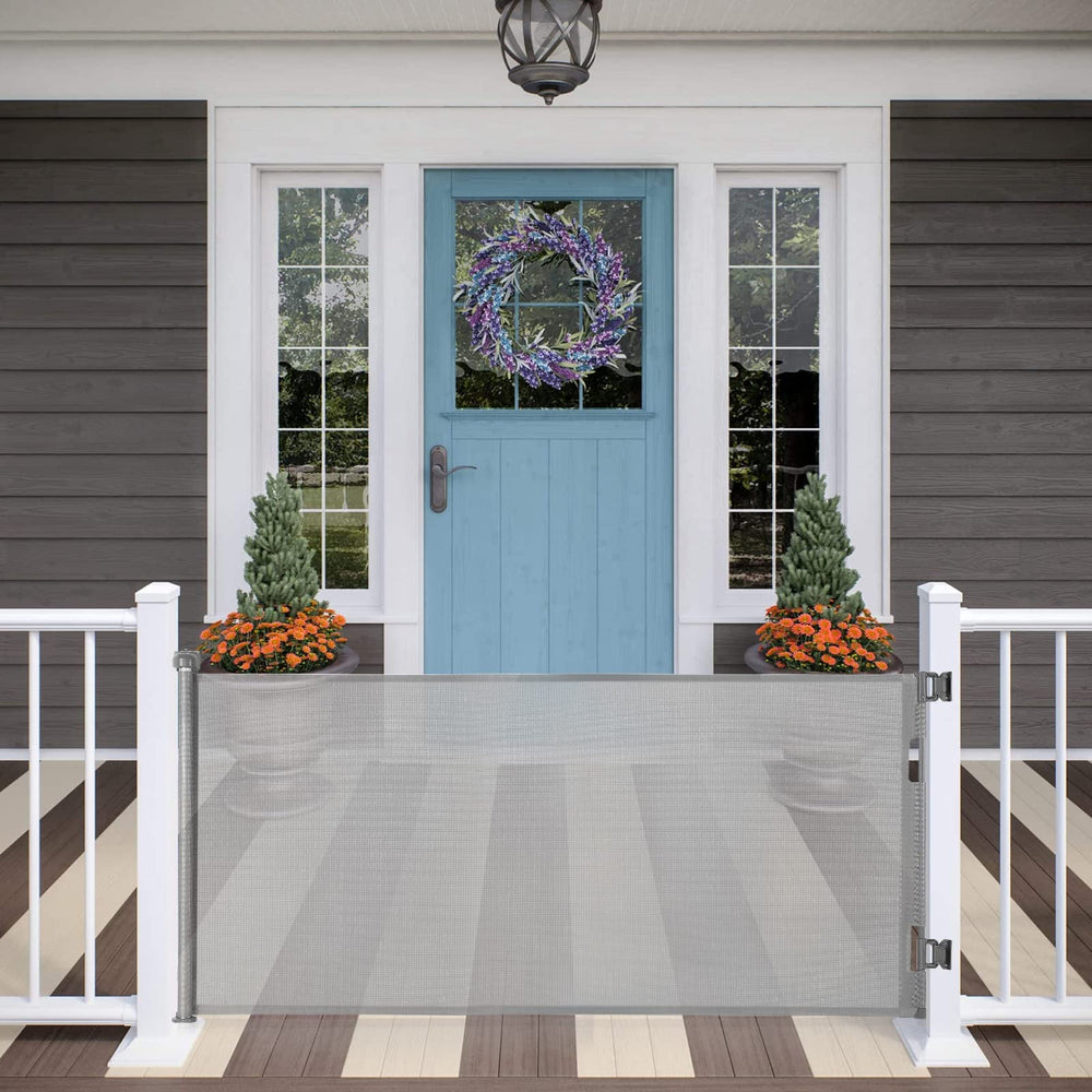 MYPIN retractable gate in a wide doorway for versatile indoor and outdoor use.