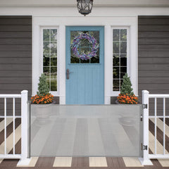 MYPIN retractable gate in a wide doorway for versatile indoor and outdoor use.