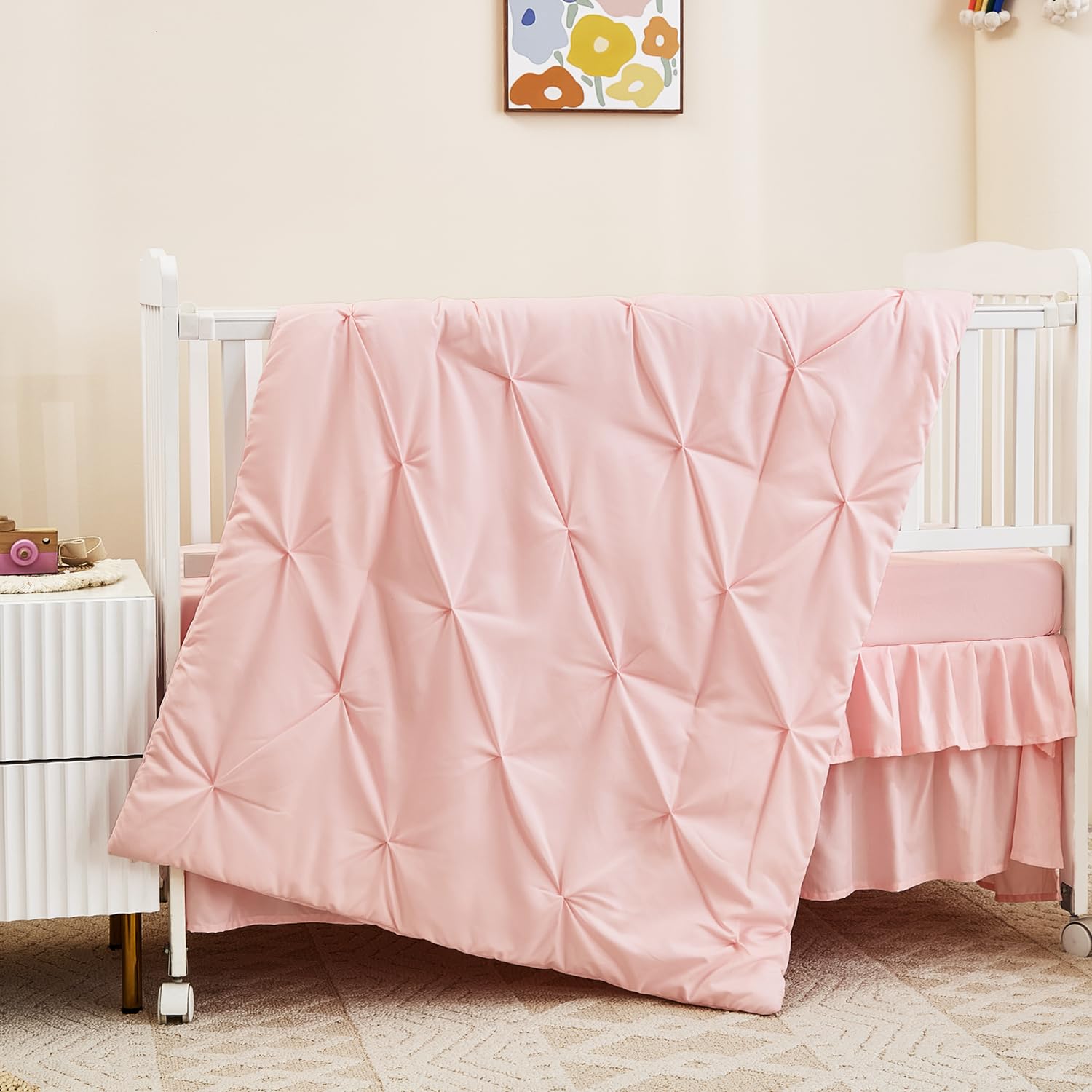 NacoMoco pink crib sheet close-up highlighting breathable fabric for comfort