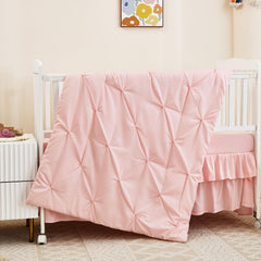 NacoMoco pink crib sheet close-up highlighting breathable fabric for comfort