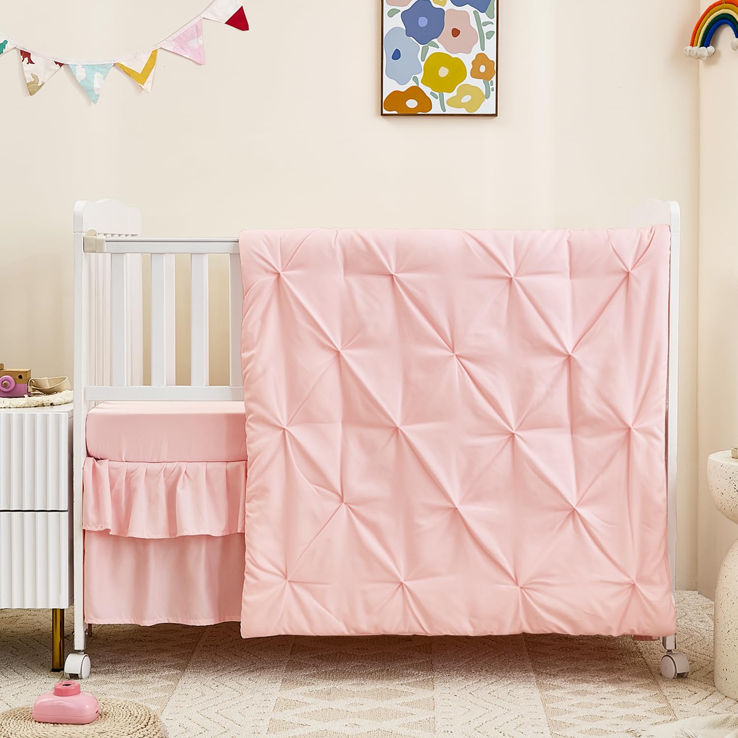 NacoMoco pink crib skirt with 14-inch double-layer hem for a neat nursery look