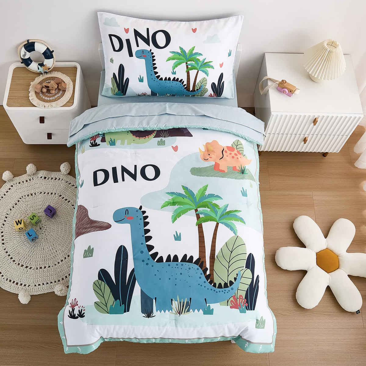 NacoMoco dinosaur bedding comforter on a toddler bed offers soft warmth.