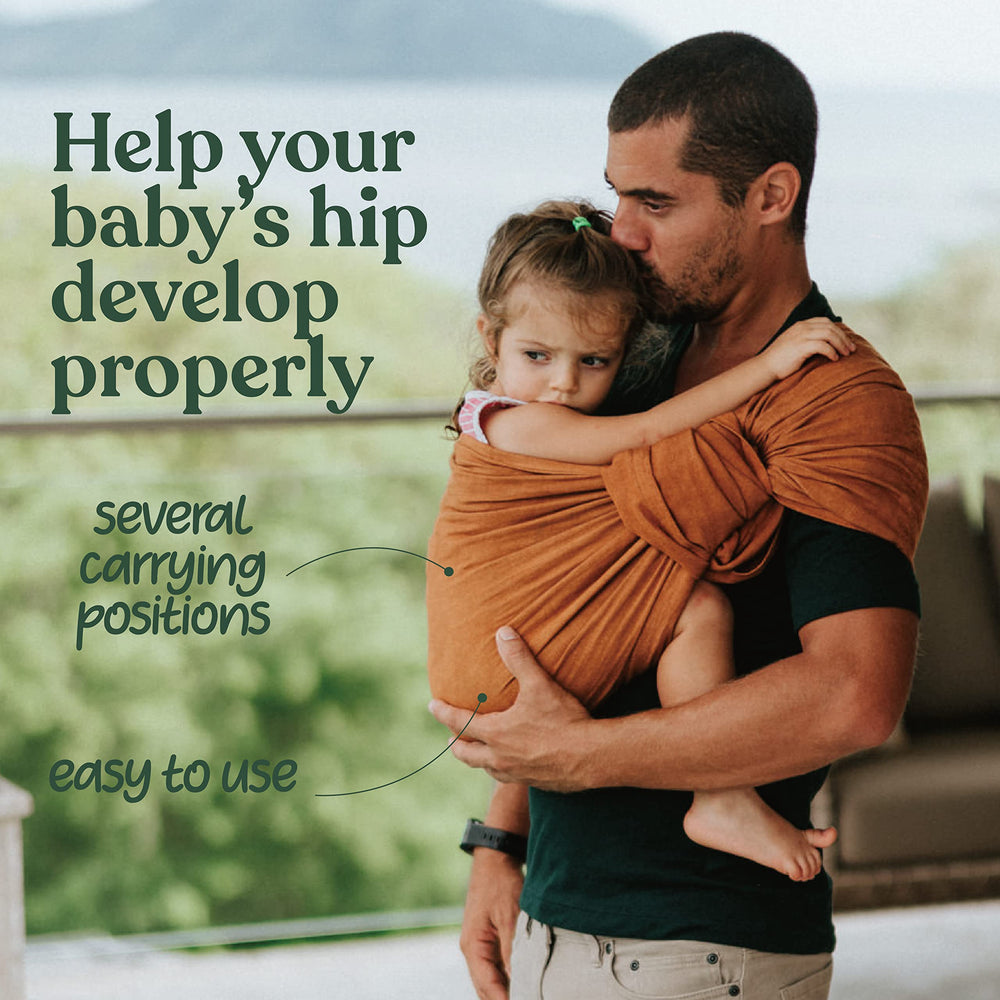 Nalakai ring sling front carry position illustrates the M-hip alignment for better hip comfort.