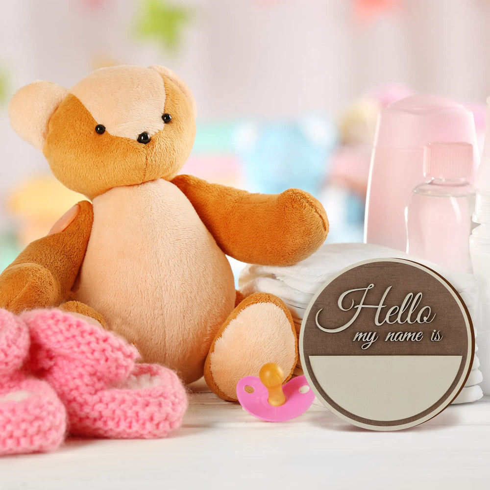 Namalu Hello World sign name-field panel for recording baby's name and birth date.