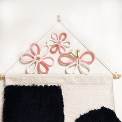 Namhcir pink boho wall decor closeup daisy highlights woven texture.