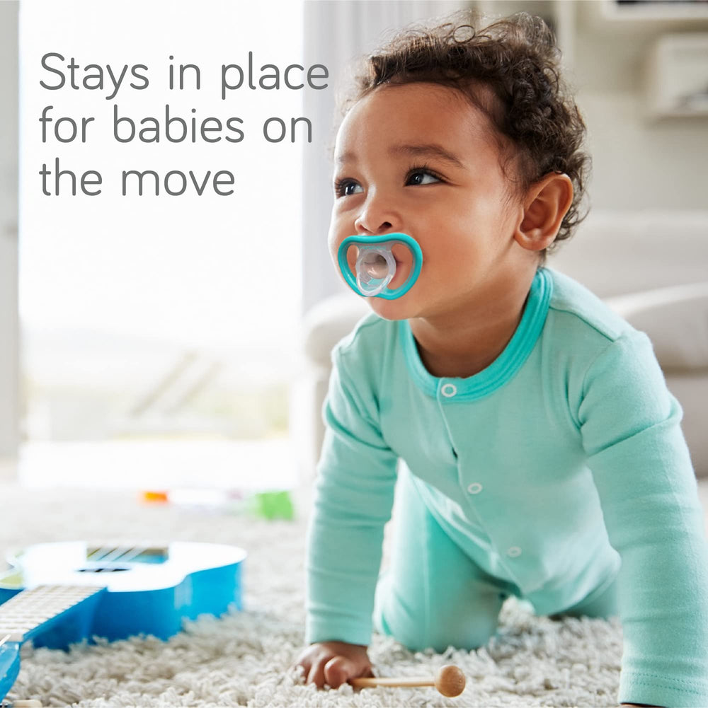 NANOBÉBÉ active pacifiers ergonomic contour fit stays secure on tiny faces.