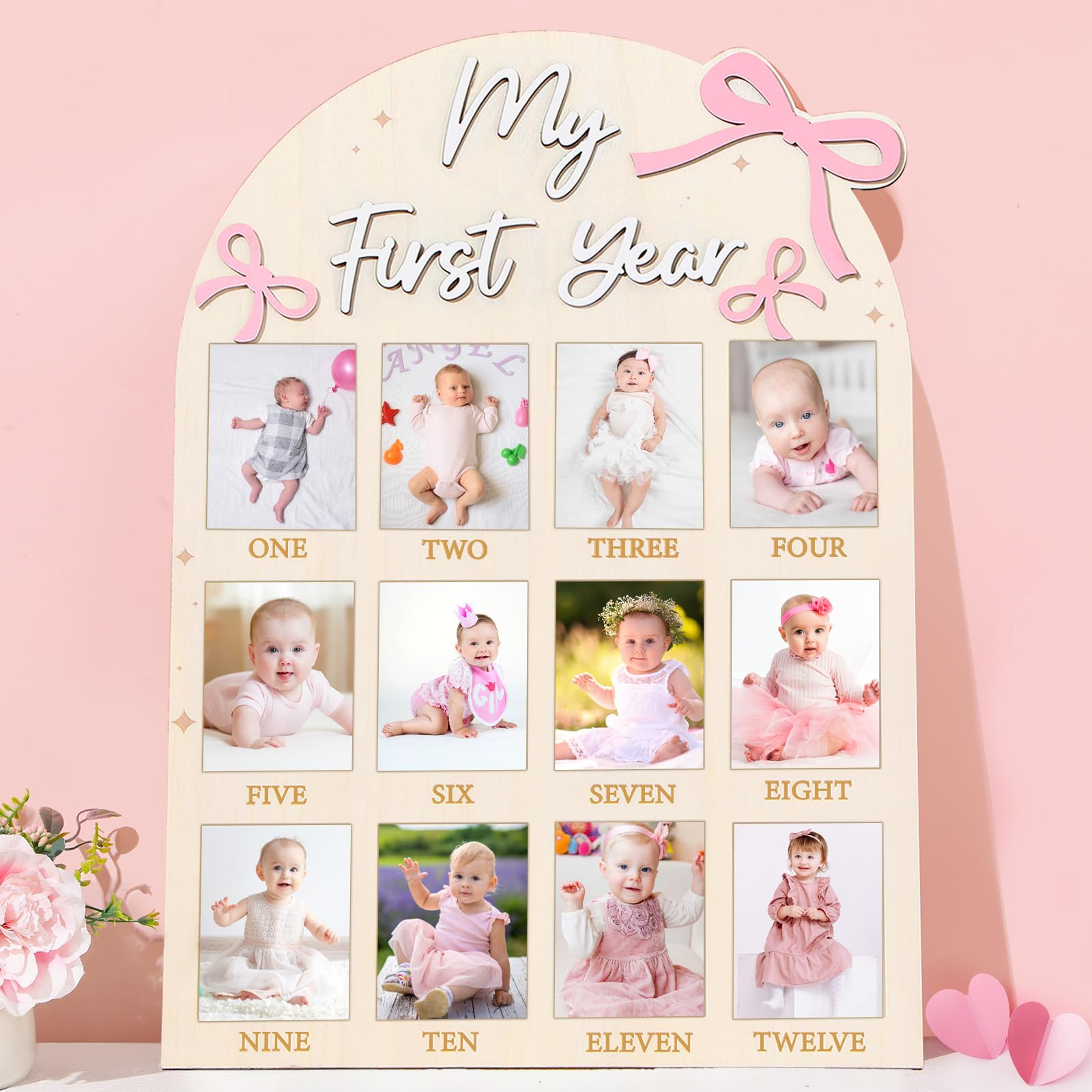 Naozinebi Pink Bow First Year Photo Board shows twelve milestone photos for a keepsake