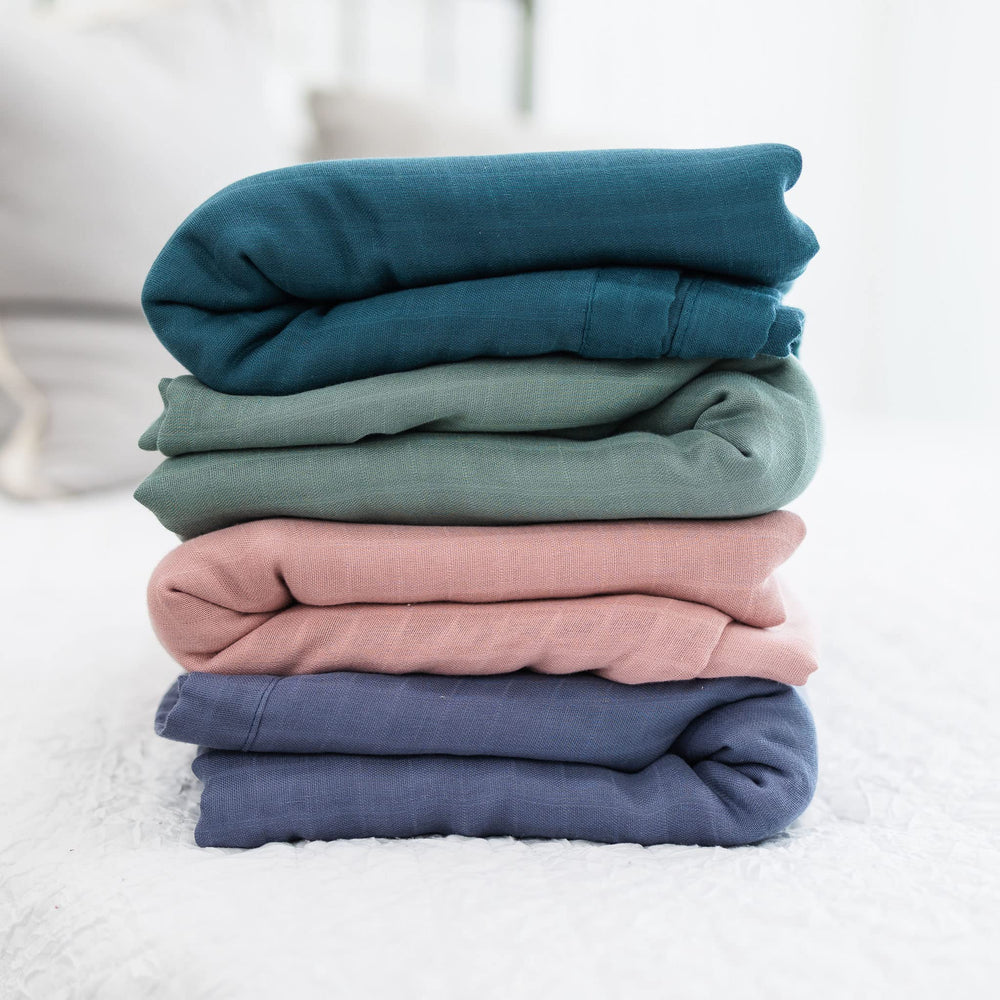 Natemia muslin baby blanket durable six-layer edges demonstrate quality.