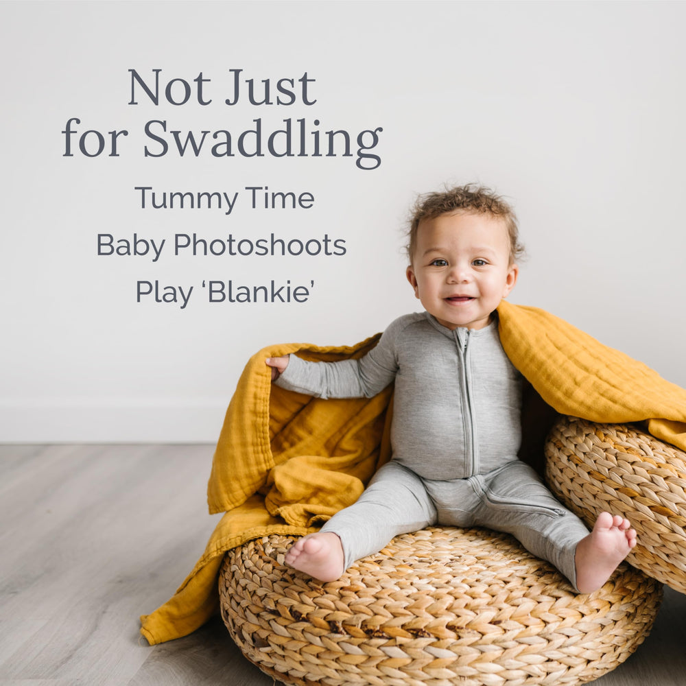 Natemia Muslin Blanket swaddle for newborns offering snug security.