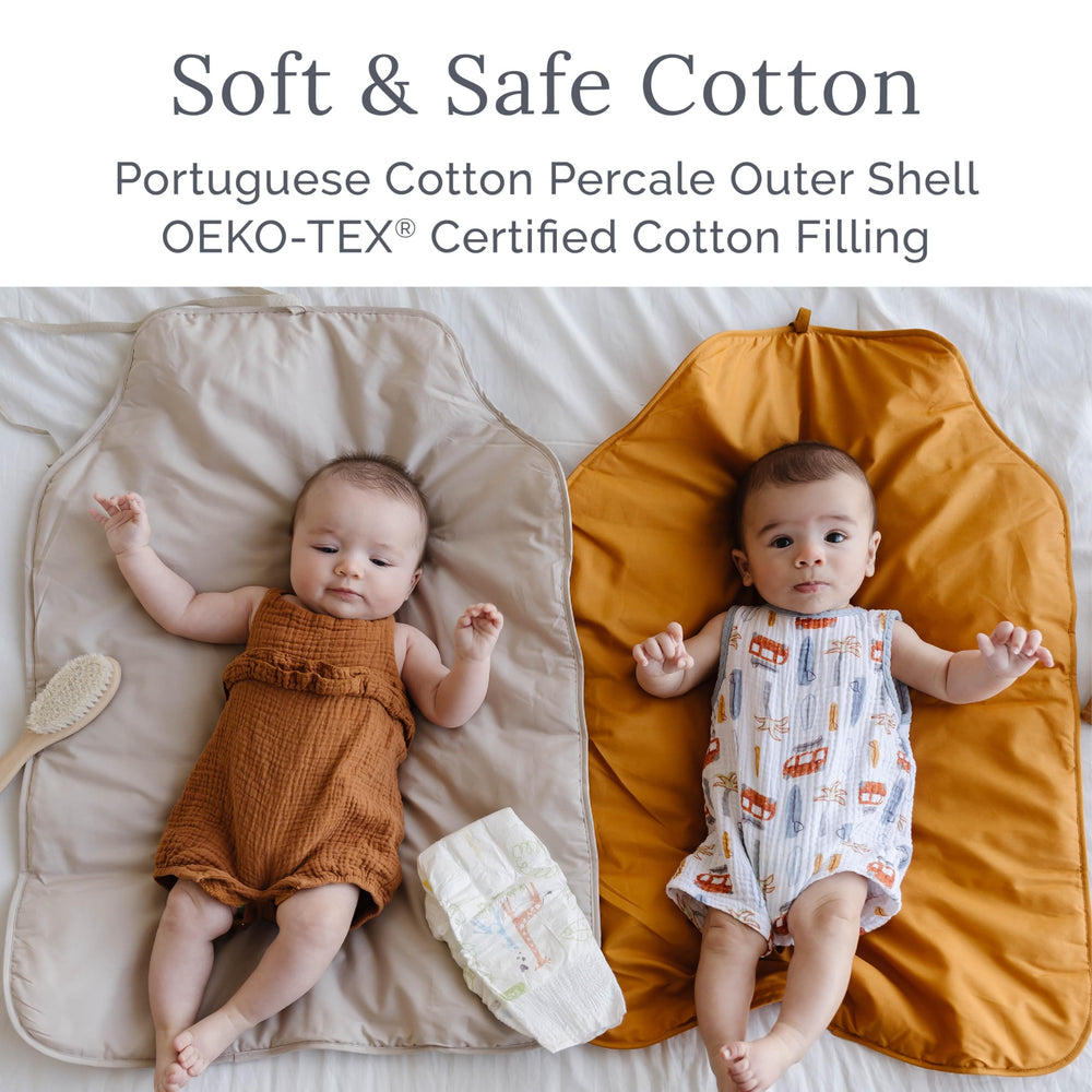 Natemia portable diaper changing pad machine wash closeup conveys simple cleanup and durability