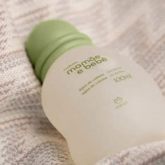 Natura Baby Cologne rolled-on wrist demonstrates portable scent for on-the-go days.