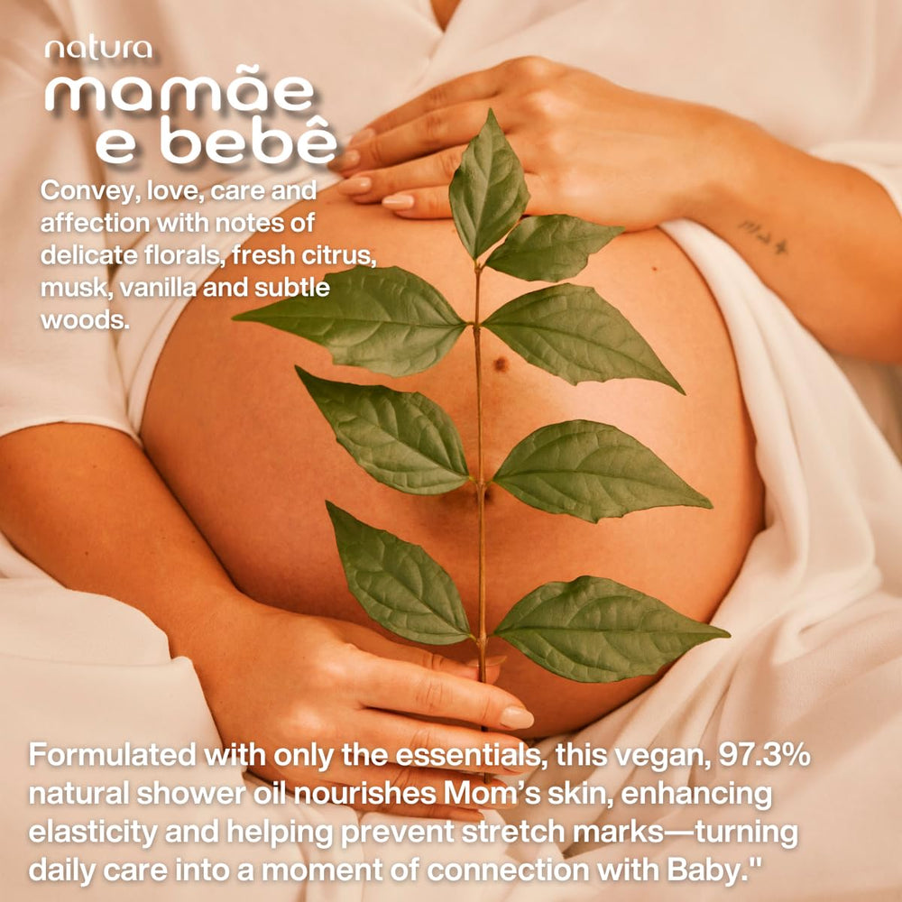 Natura Mamae e Bebe moisturizing shower oil applied during bath for hydration.