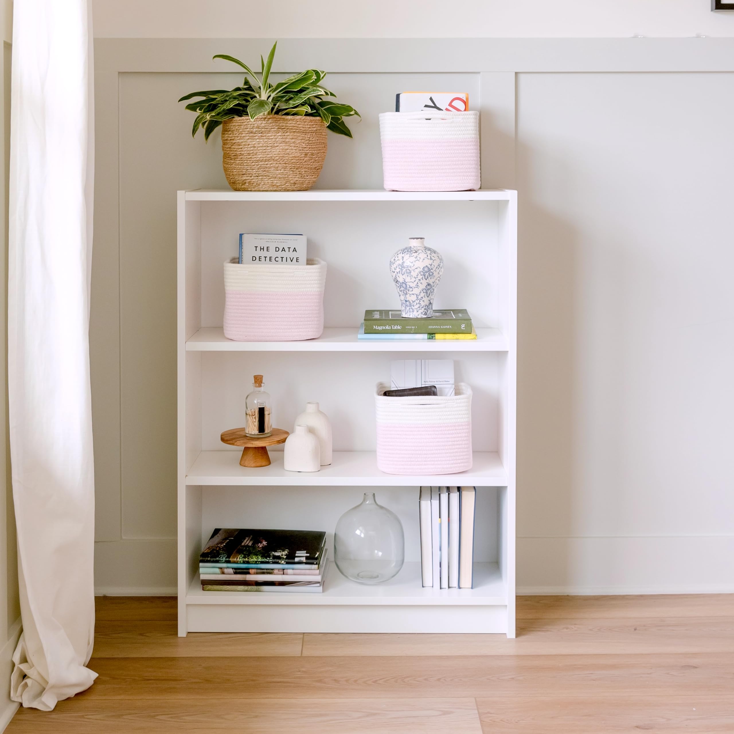NaturalCozy bathroom closet arrangement highlights compact decorative storage.