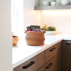 NaturalCozy nursery storage basket keeps baby items within reach.