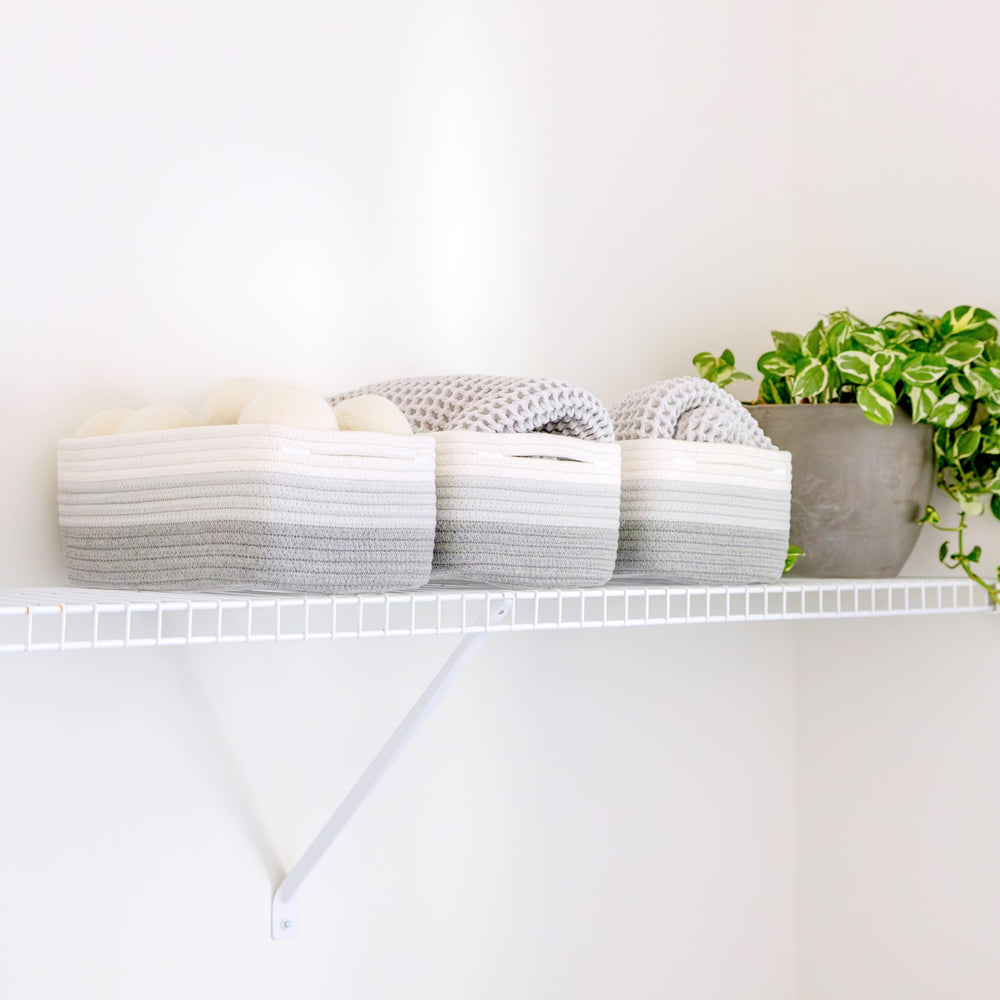 NaturalCozy rectangle basket bathroom organization keeps towels within easy reach.