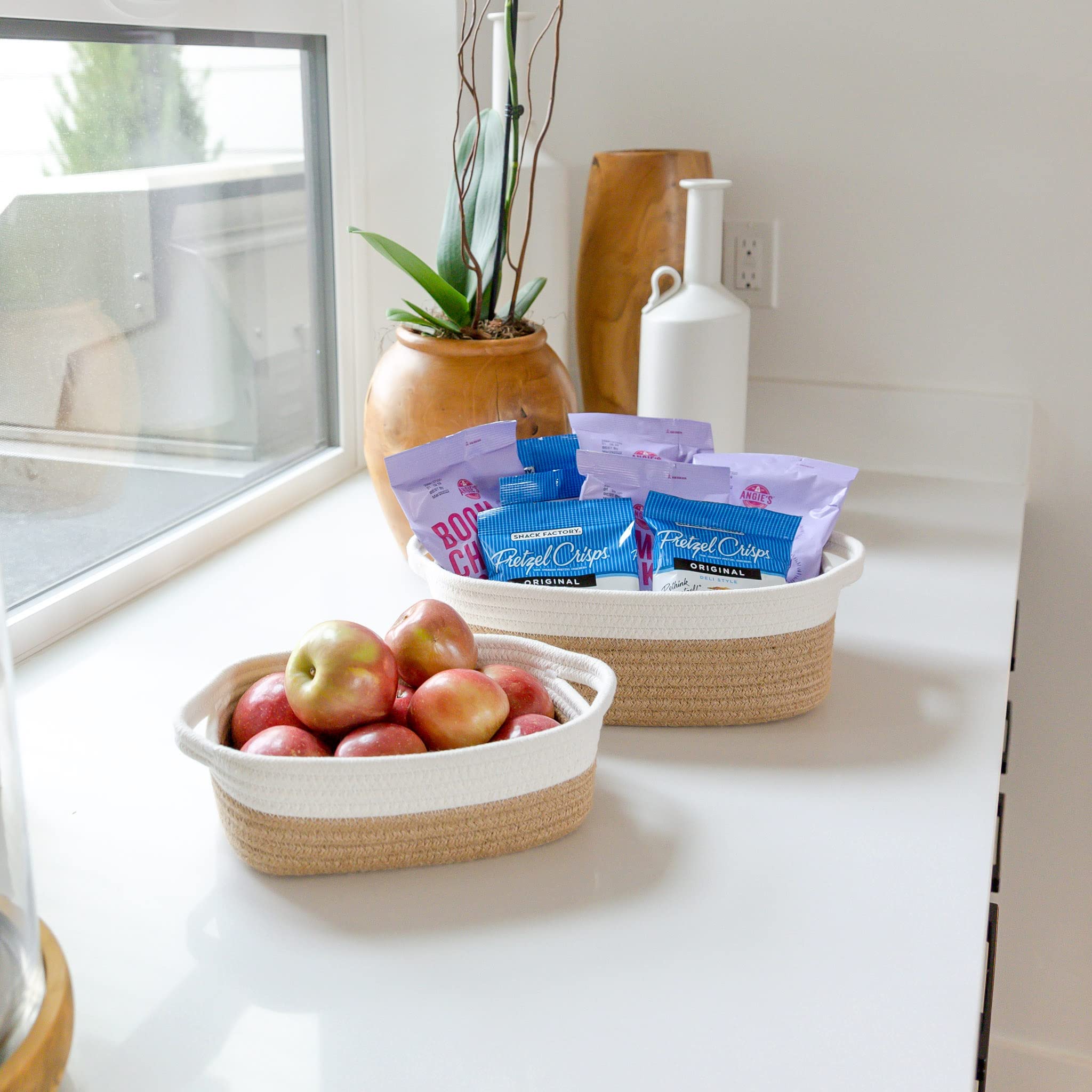 NaturalCozy medium storage basket tucked beside a sink for towels or toiletries.