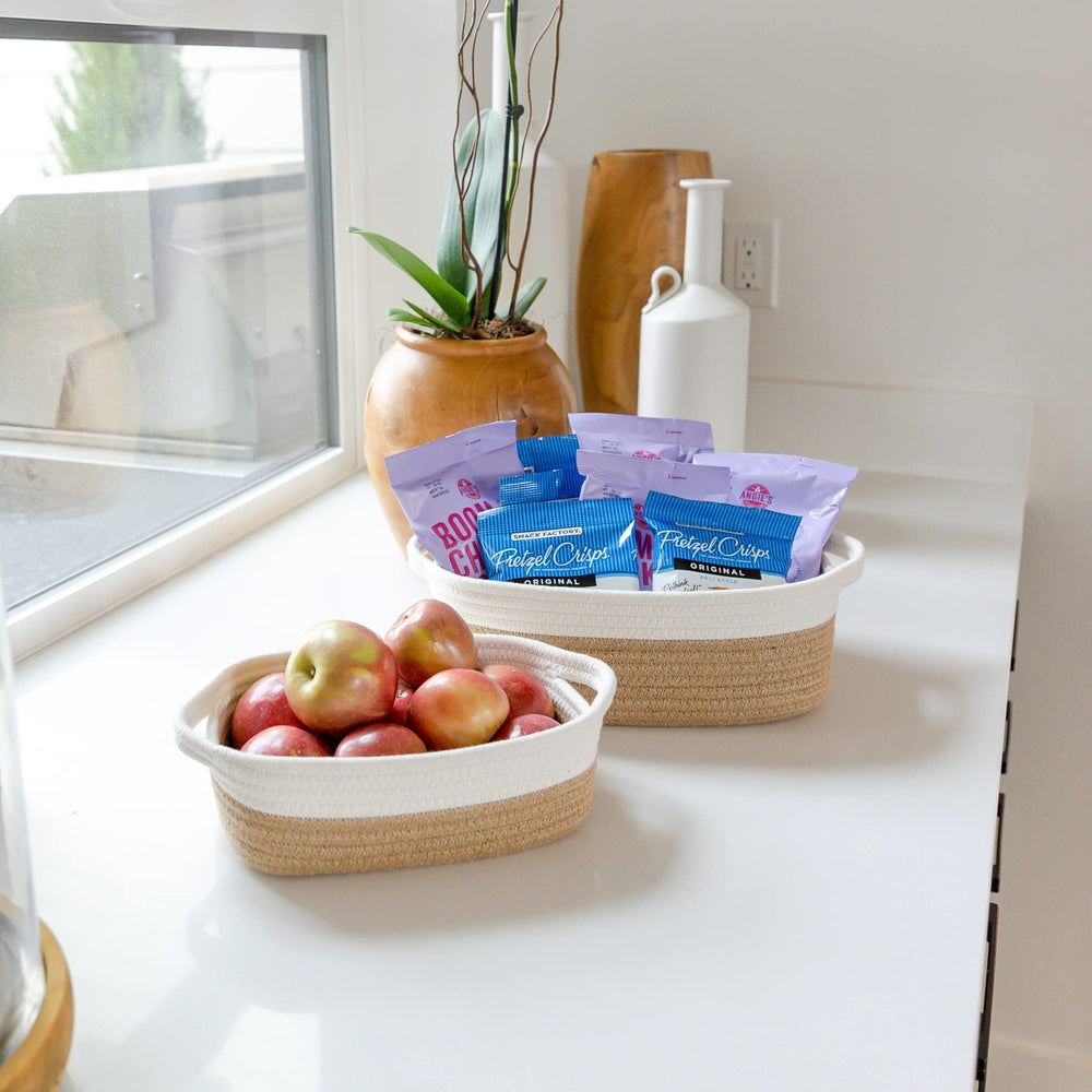 NaturalCozy medium storage basket tucked beside a sink for towels or toiletries.