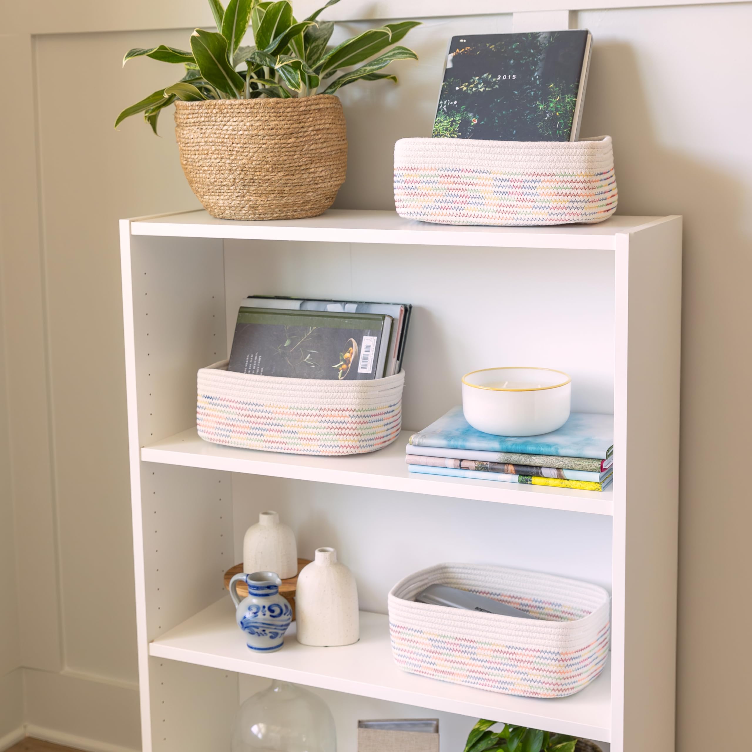 NaturalCozy rope basket on toy-filled playroom shelf