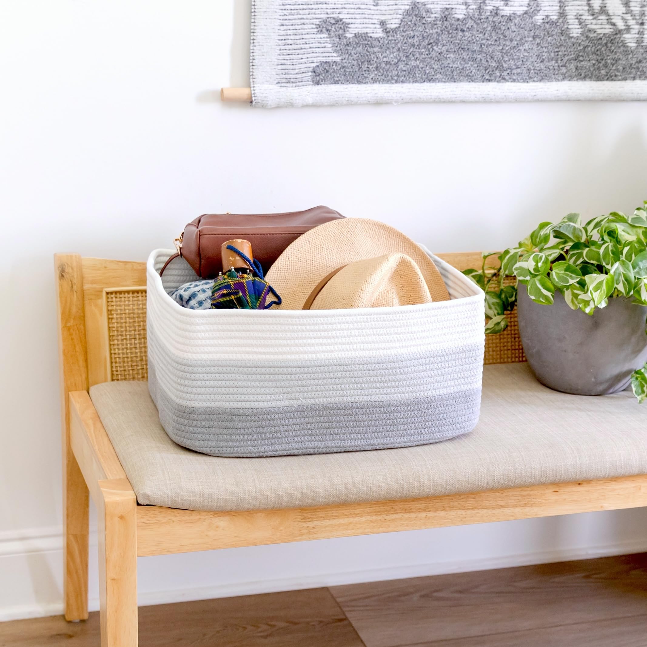 NaturalCozy storage baskets in bedroom closet simplify clothing and accessory sorting.