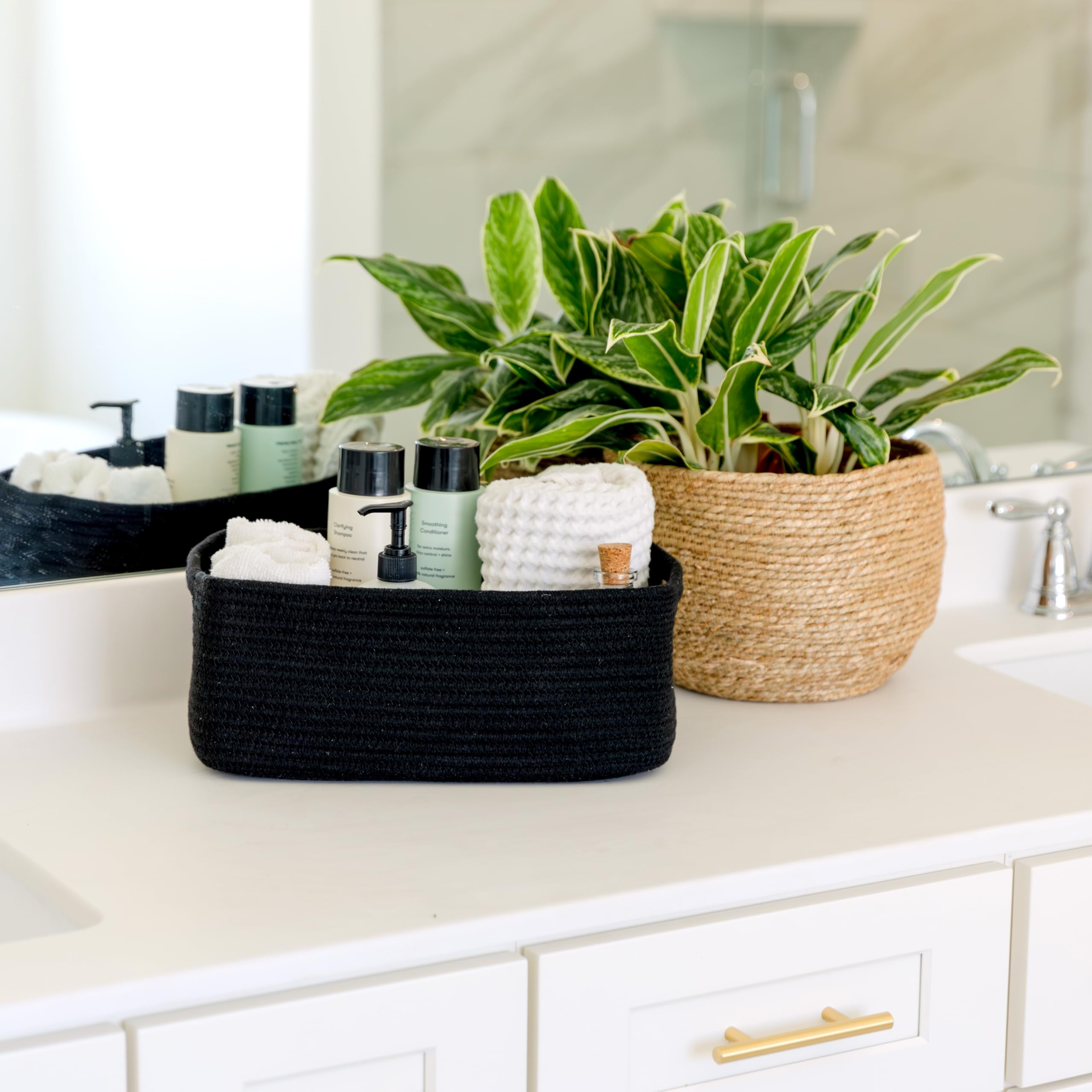 NaturalCozy storage bins on shelf organize towels, diapers, and books