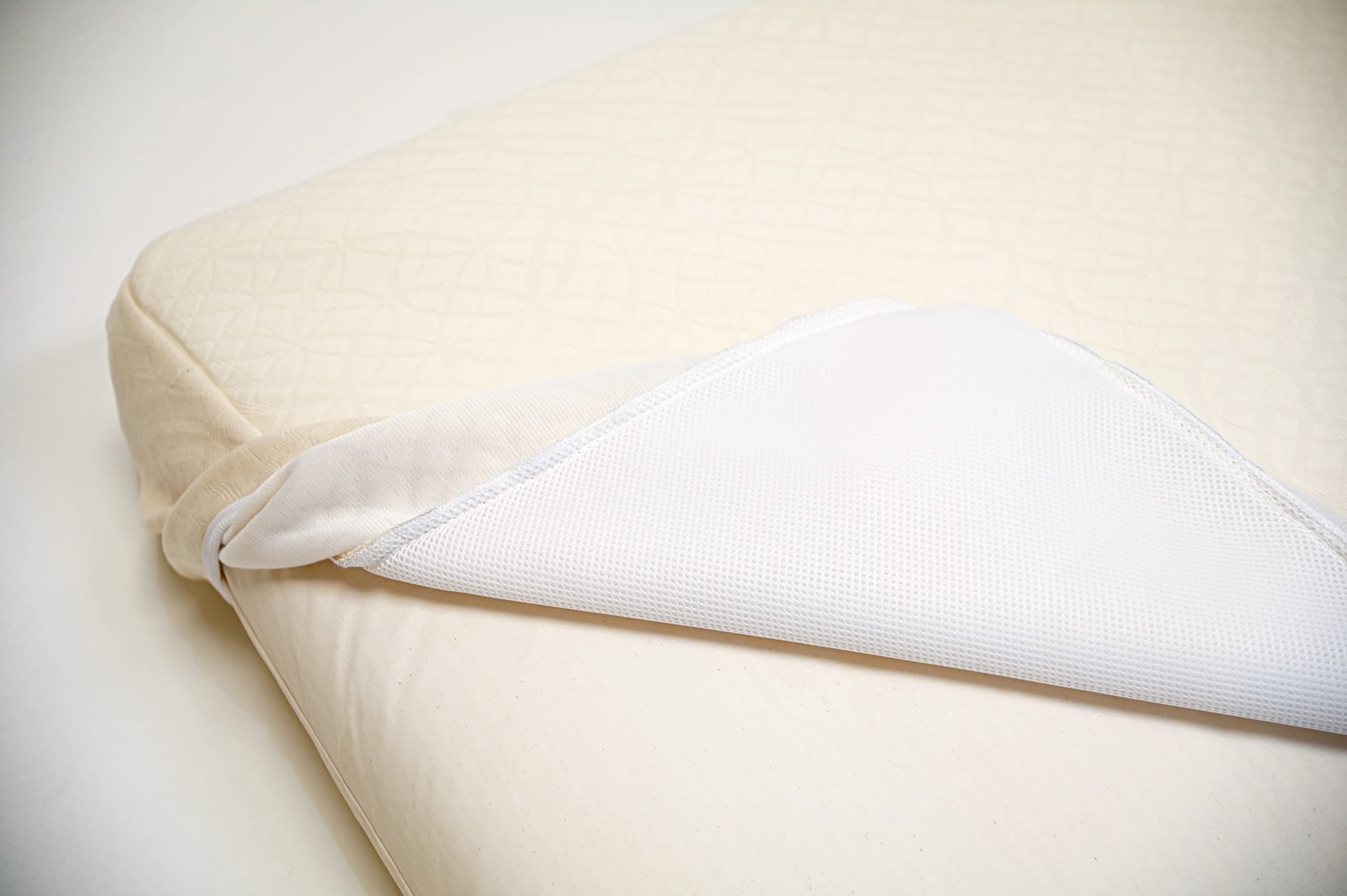 Naturepedic organic cotton fabric close-up indicating easy-clean surface