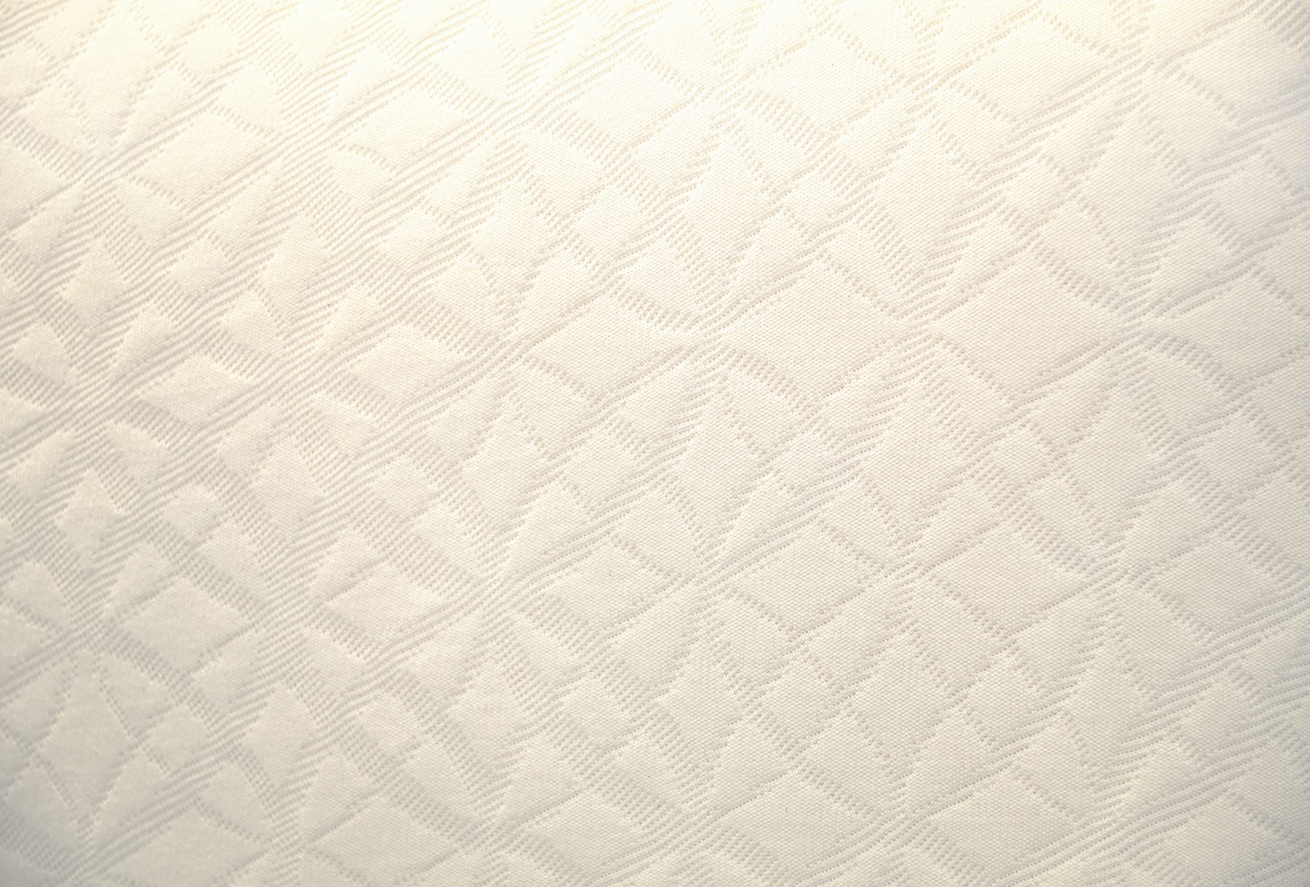 Naturepedic standard-size crib mattress pictured in a cozy nursery setup