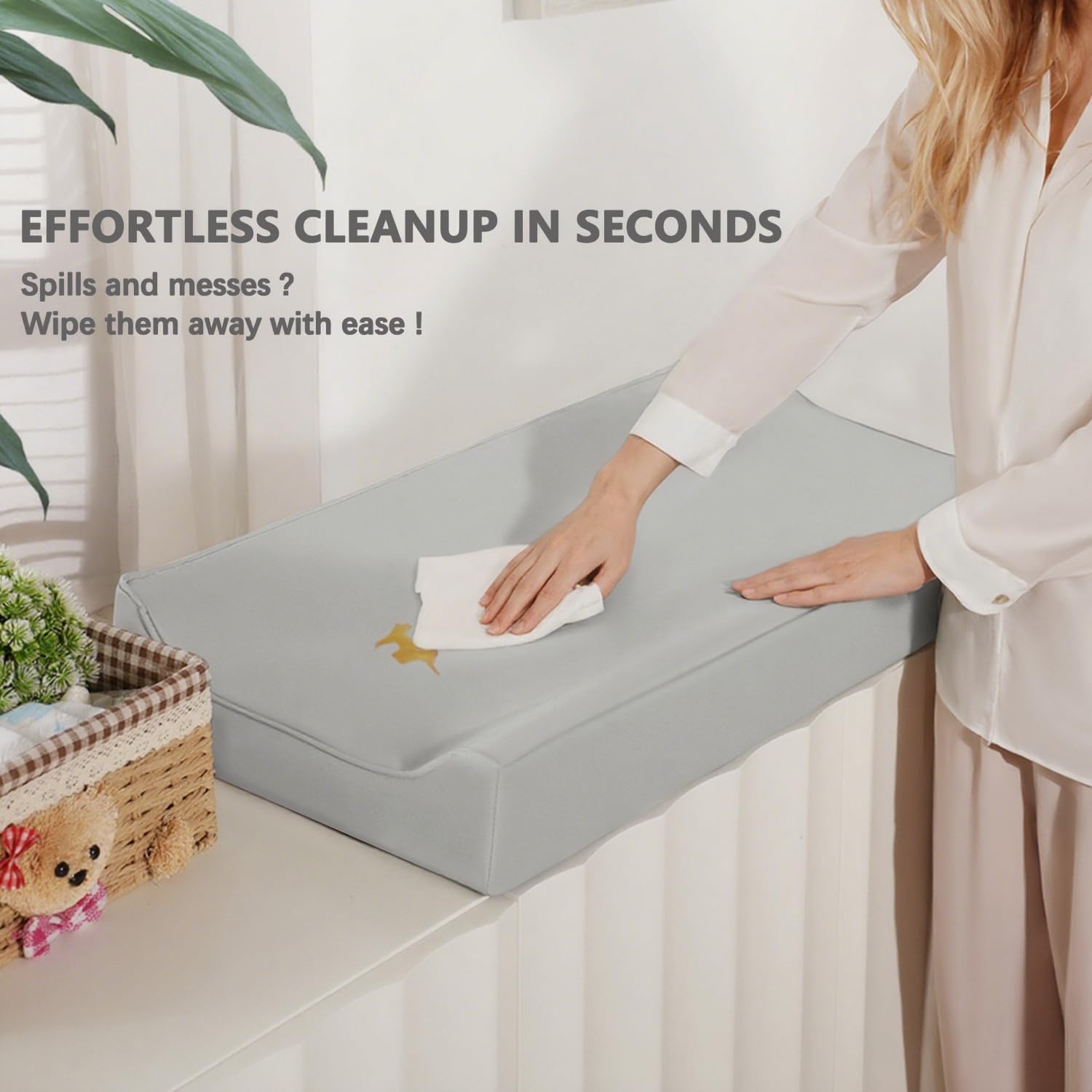 Navari vegan leather changing pad cover uses elastic edges for a secure non-slip fit.