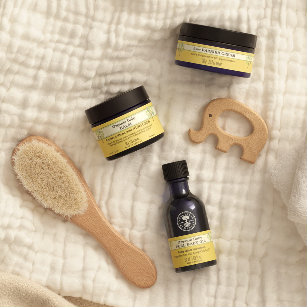 Neal's Yard Remedies Baby Balm on body application shows soothing nourishment
