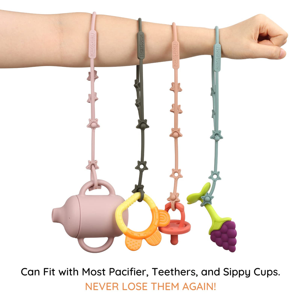 Nearbyme toy straps close-up of the adjustable push-button buckle for easy length changes.