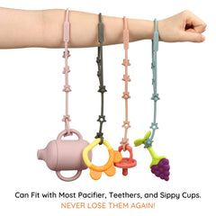 Nearbyme toy straps close-up of the adjustable push-button buckle for easy length changes.