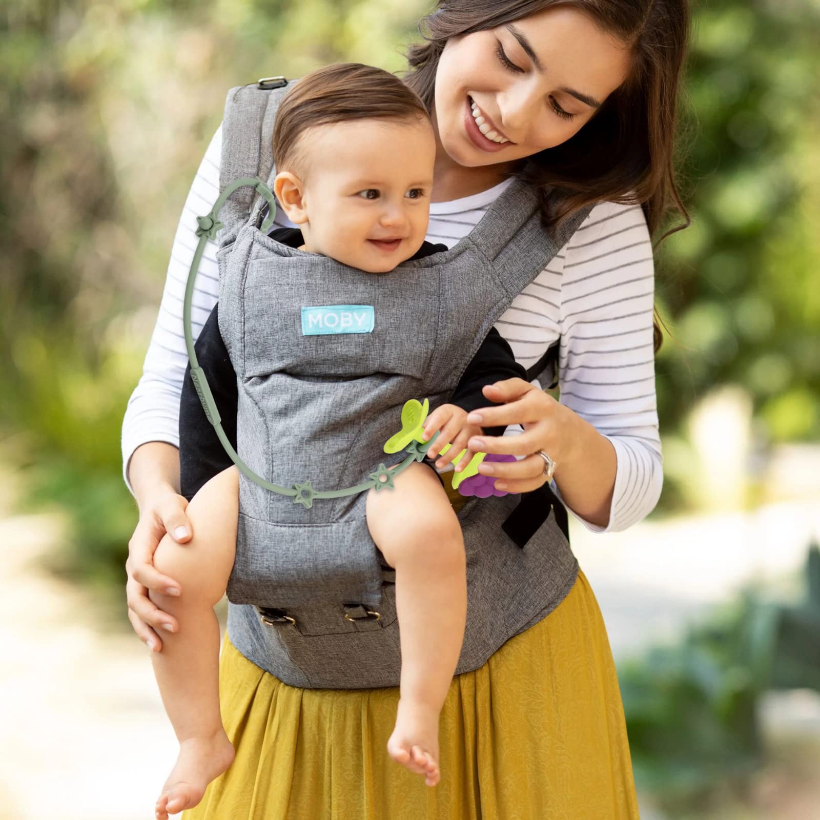 Nearbyme toy straps securing a toy and snack, demonstrating multifunctionality.