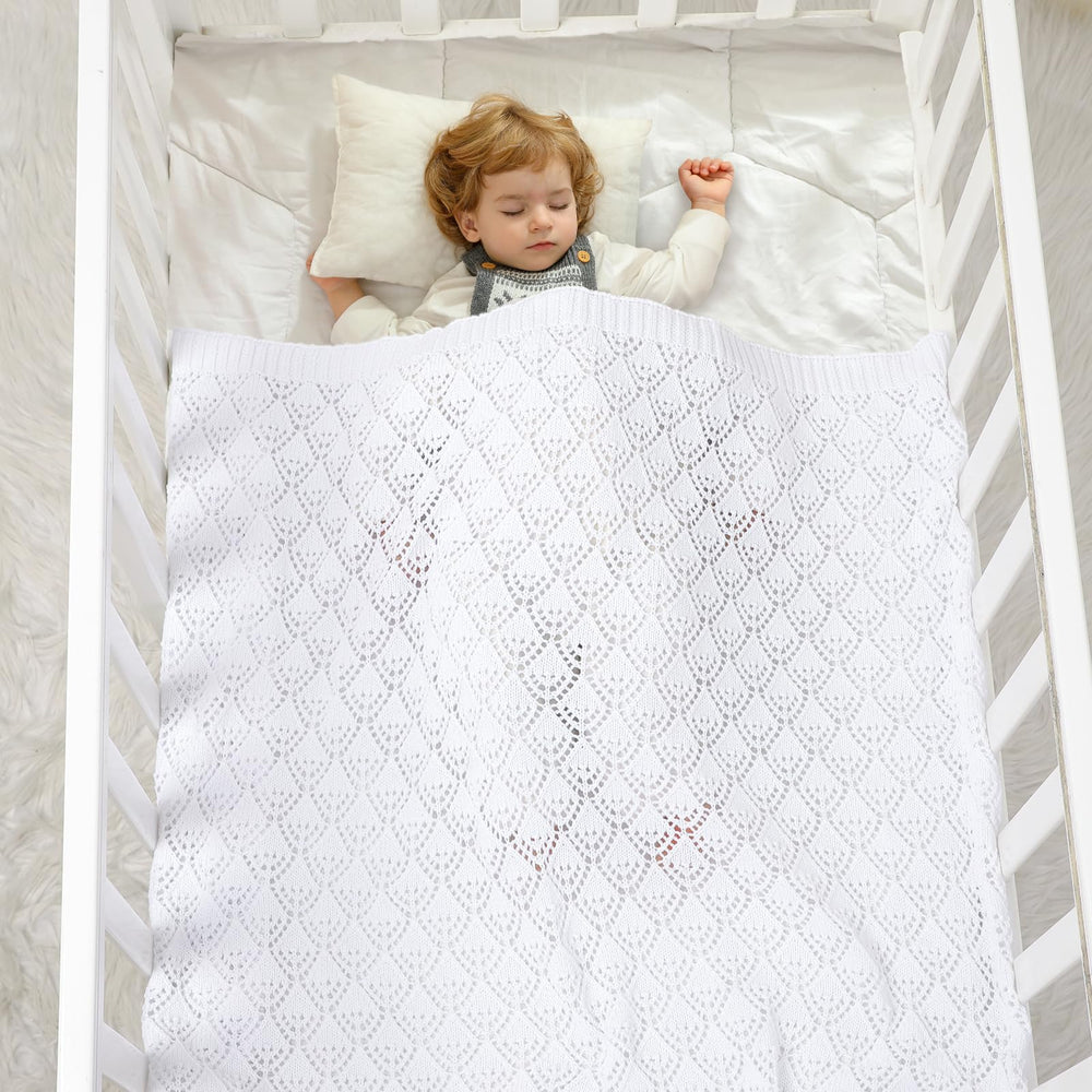 Neiwech cotton cellular baby blanket in crib use for cozy nursery time