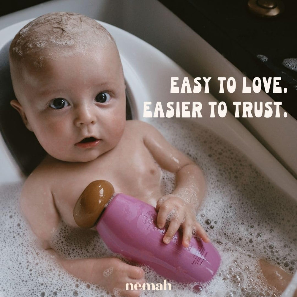 Nemah baby wash-shampoo pour shows easy tear-free application during bath time.