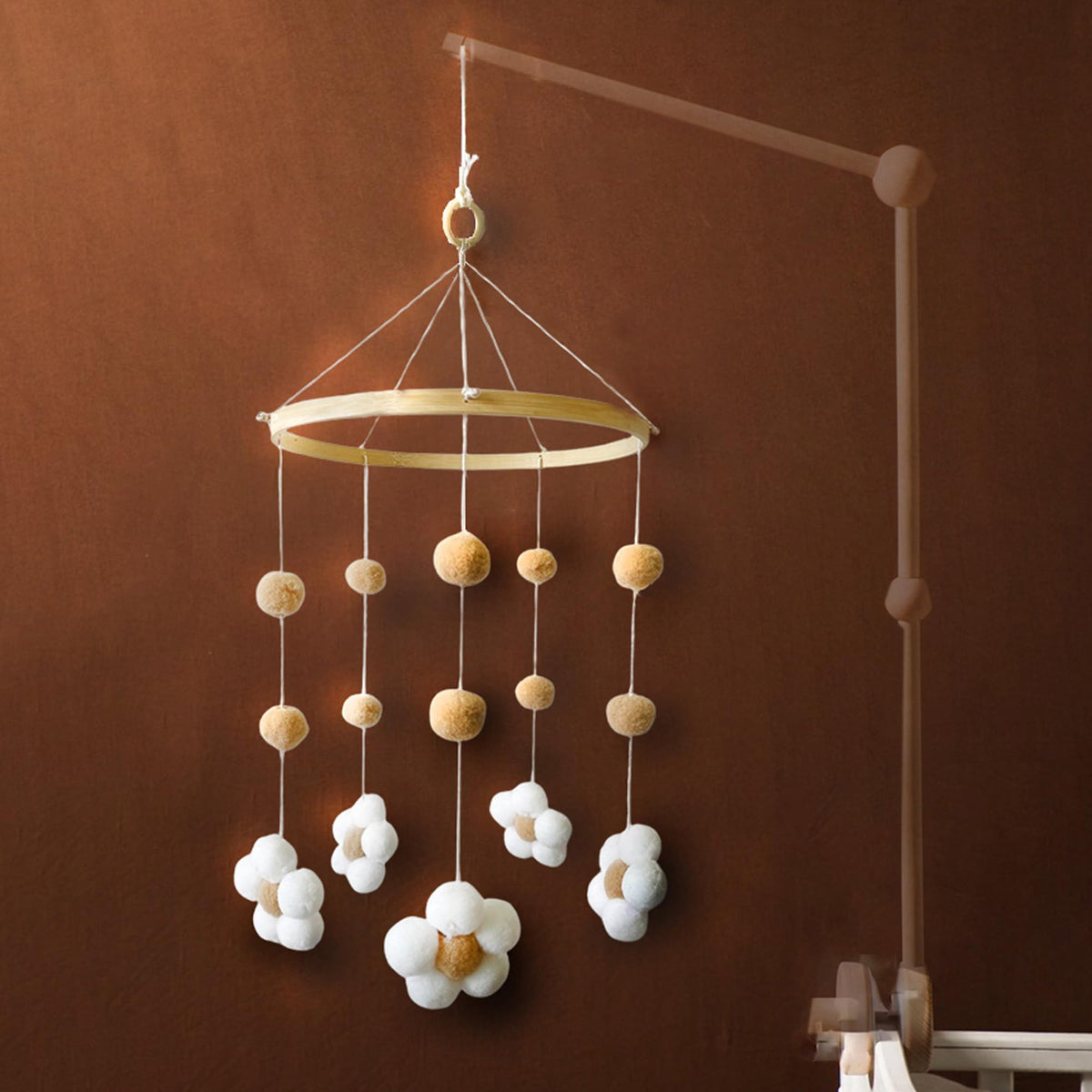 Nerdichic baby crib mobile with felt daisy flowers promotes gentle visual engagement.