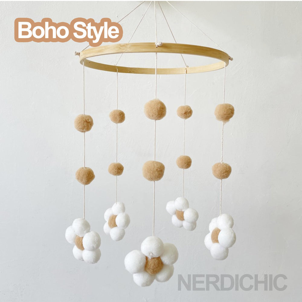 Nerdichic nursery decor mobile blends soft wood and felt for a cozy room.