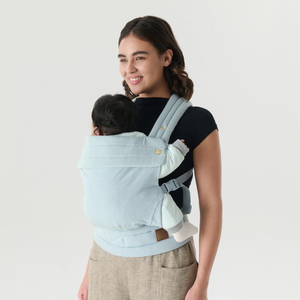 Nest Blanche denim baby carrier back view highlights even weight distribution.