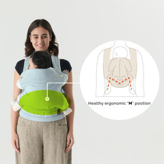 Nest Blanche denim carrier with padded legs for infant comfort.