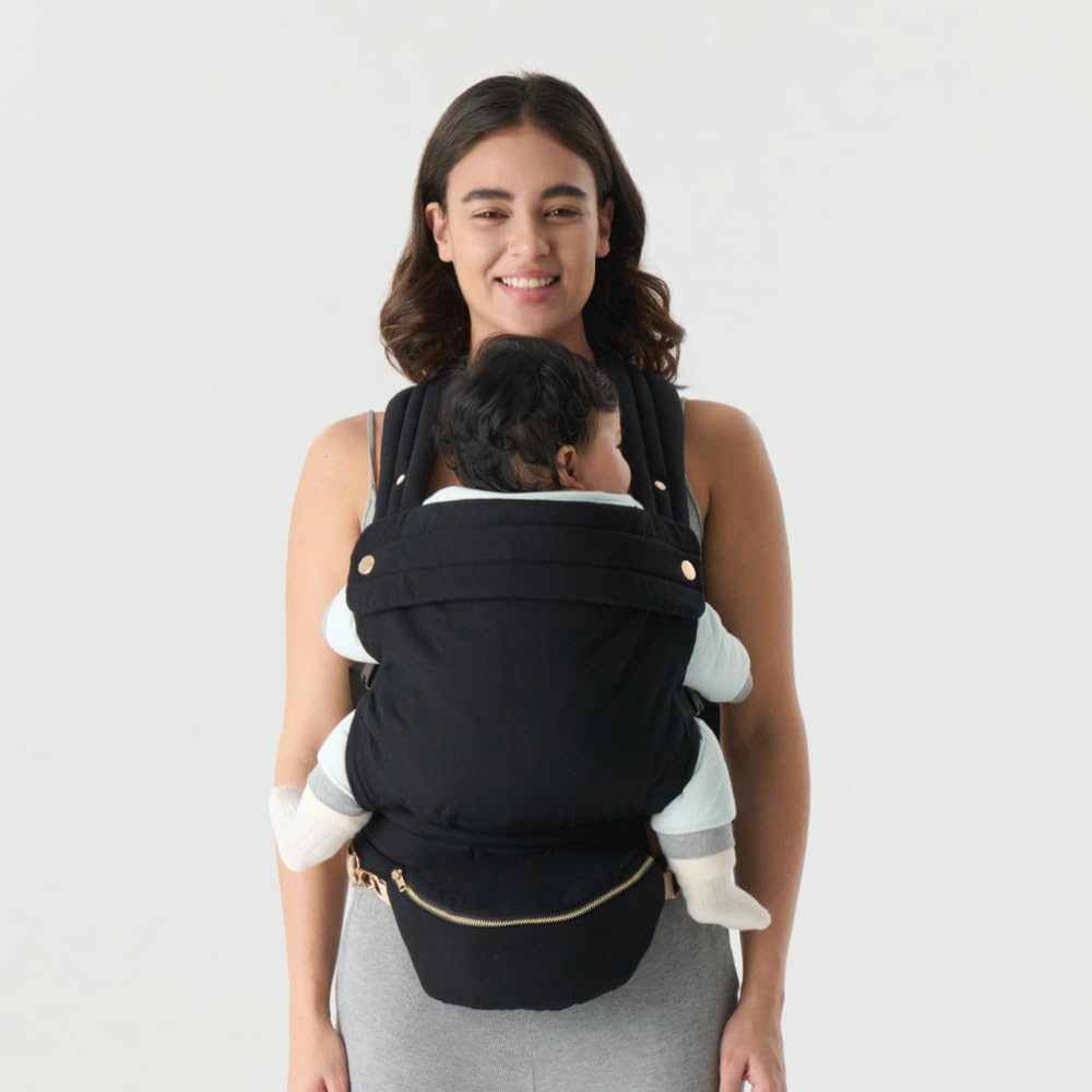 Nest Blanche ergonomic baby carrier back view showing supportive waistband for all-day wear.