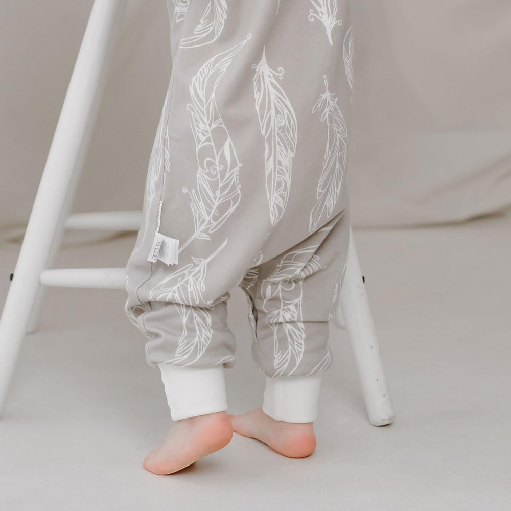 Nest Designs two-way zipper with flap and bottom snaps ease dressing and diaper changes.