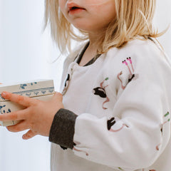 Nest Designs fold-over ankle cuffs keep feet warm as toddler grows.