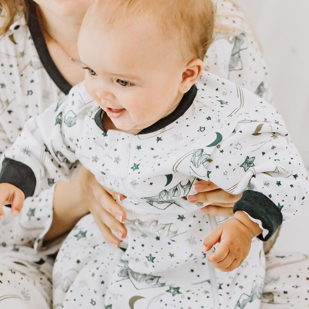 Nest Designs Stars White sleep bag in use at bedtime for a calm nursery.