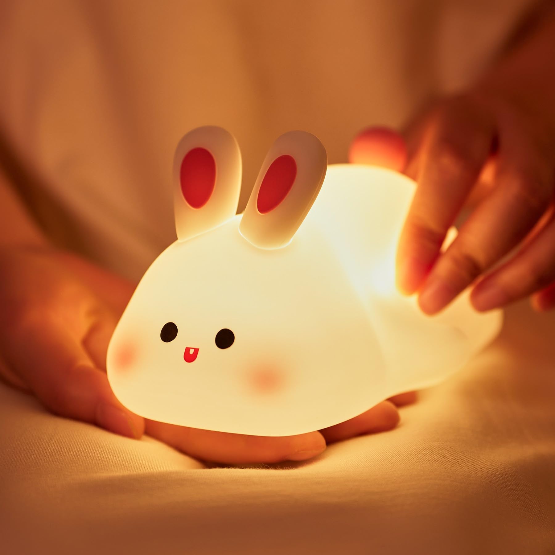 NesveCit big-face rabbit night light on table offers gentle ambient glow for bedtime