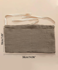 NewLuyer bedside organizer shows diapers, wipes, bottles in two handy pockets.