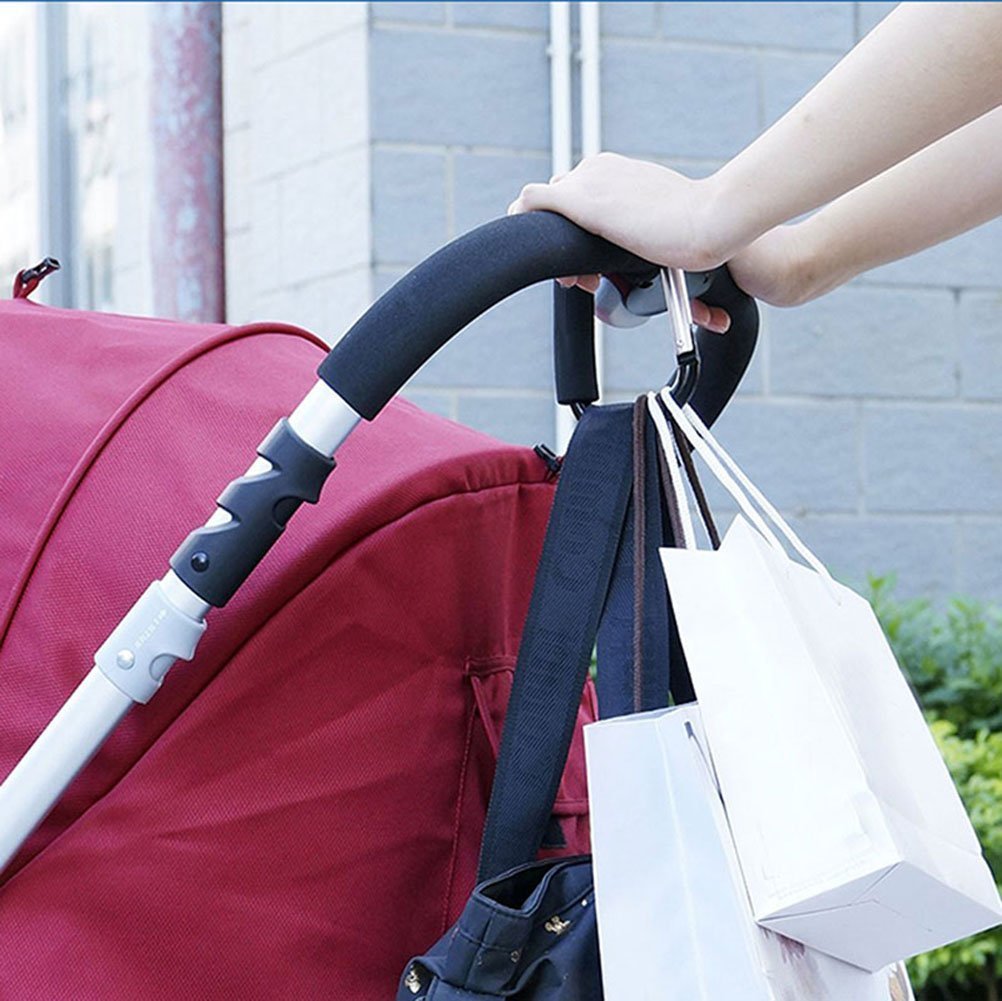 Newraturner diaper bag hanging from stroller with organized gear