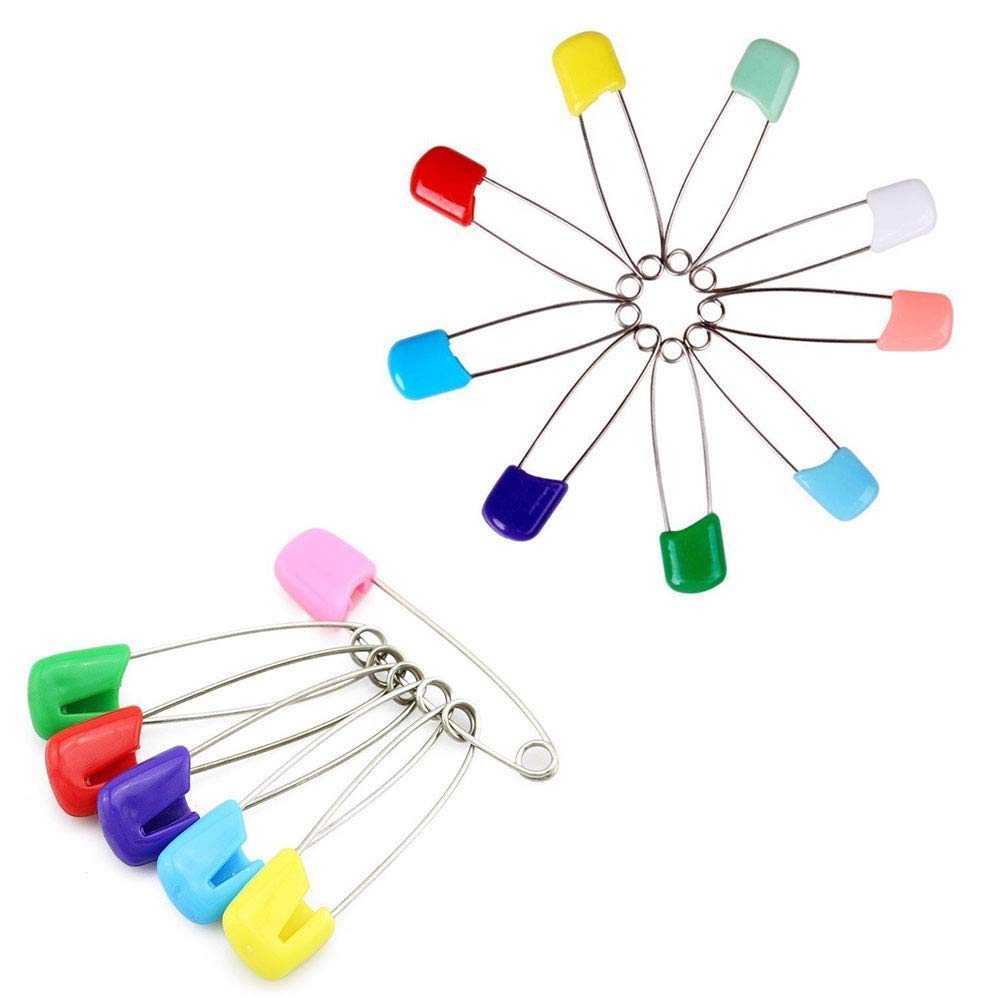 Newsfana diaper pins in use for cloth diapering and baby outfits