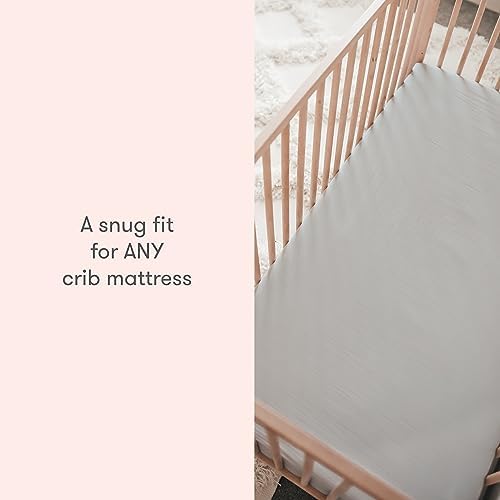 Newton Baby fitted crib sheet demonstrates snug elastic fit on a standard crib mattress