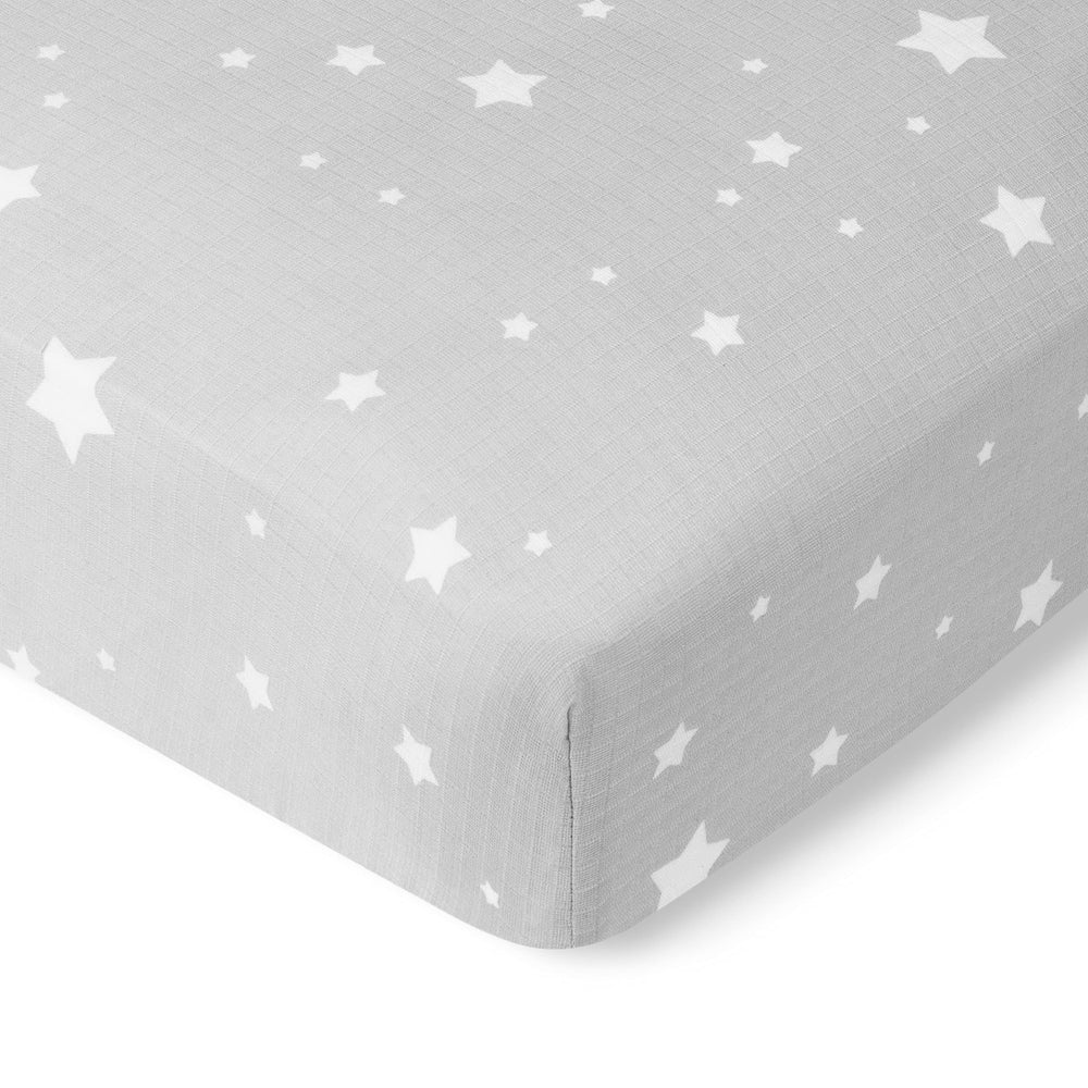 Newton Baby fitted crib sheet with secure elastic fit on standard crib