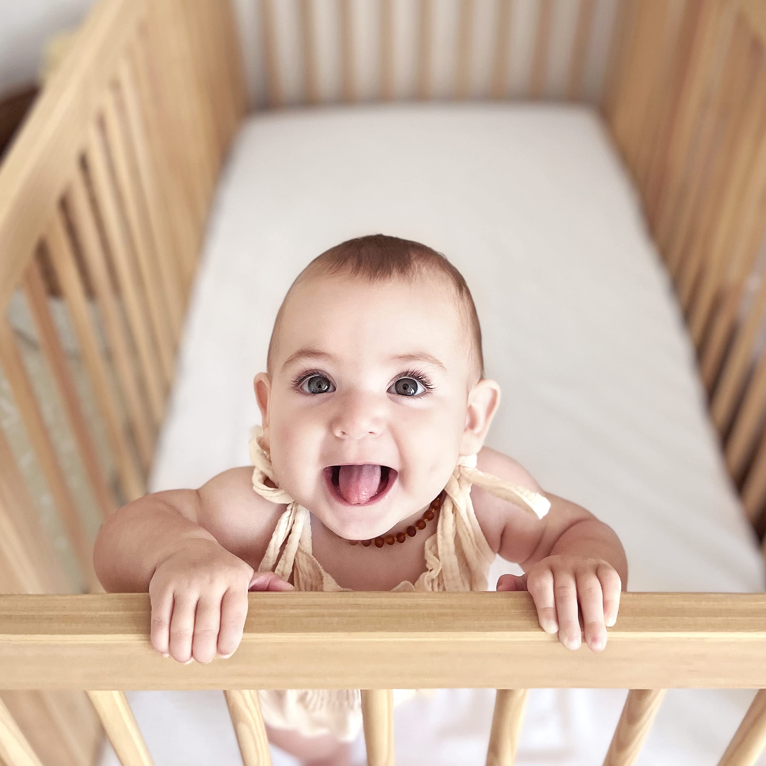 Newton Baby sheet on mattress shows breathable fabric and clean feel