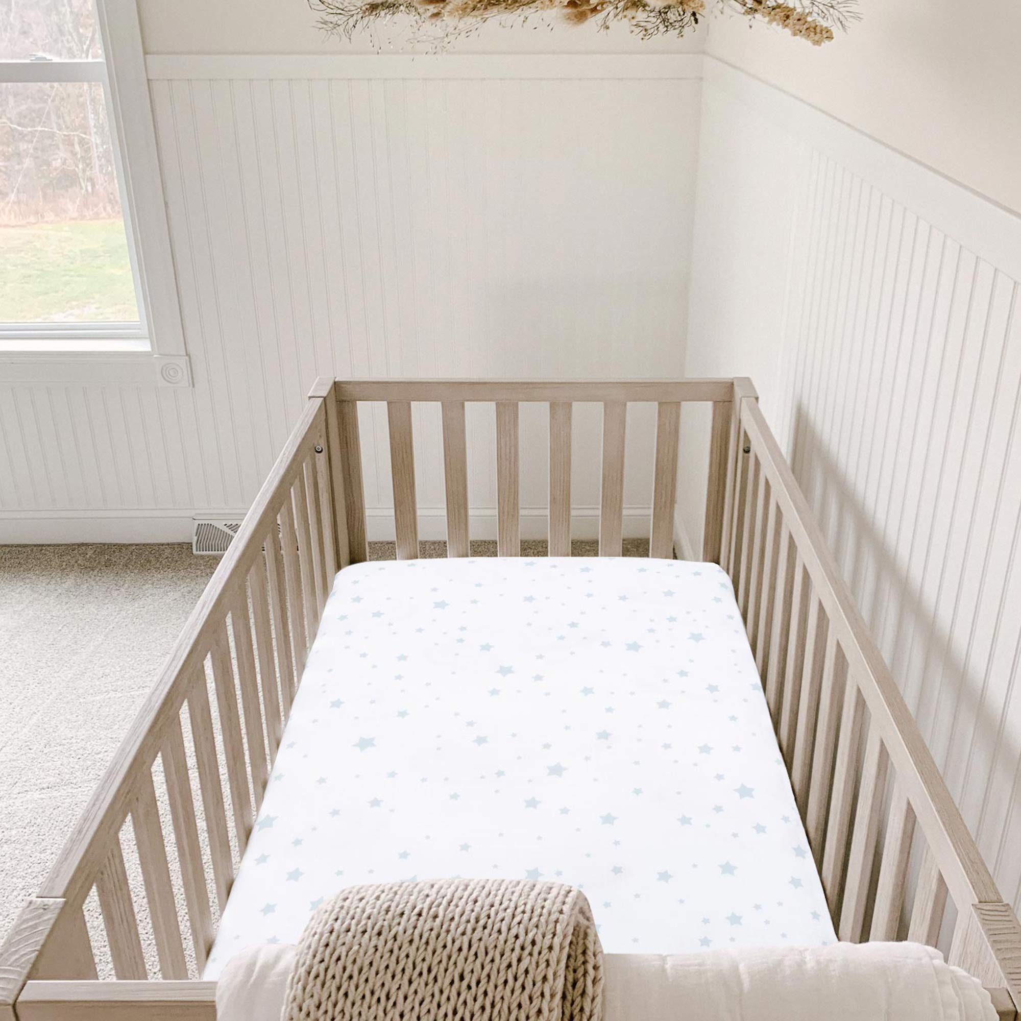 Newton Baby fitted crib sheet organic cotton soft texture suits sensitive skin.
